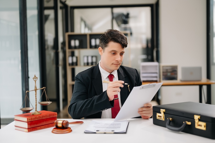 lawyer at desk reviews document in office 2026 01 05 23 25 20 utc
