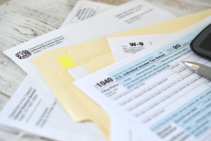 tax forms and calculator on desk surface 2026 03 24 07 07 09 utc
